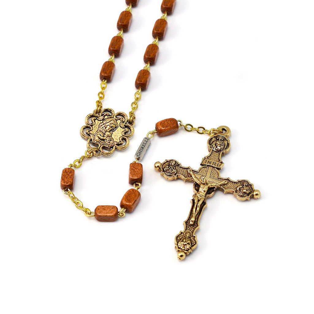Rosary with brown beads and gold crucifix on a white background