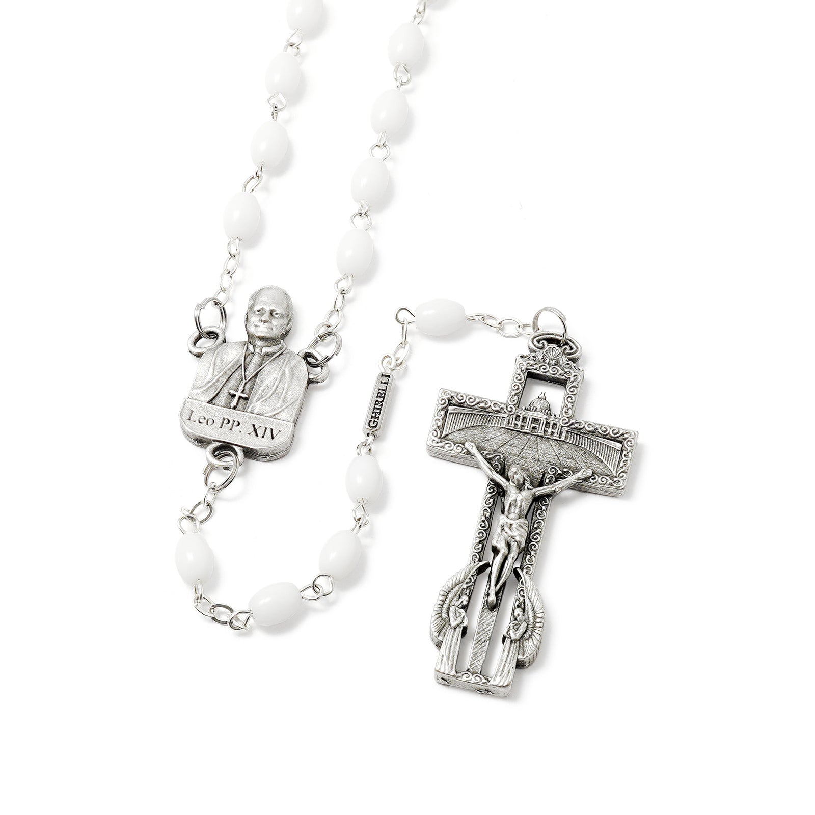White rosary with silver crucifix and saints' statues on a white background