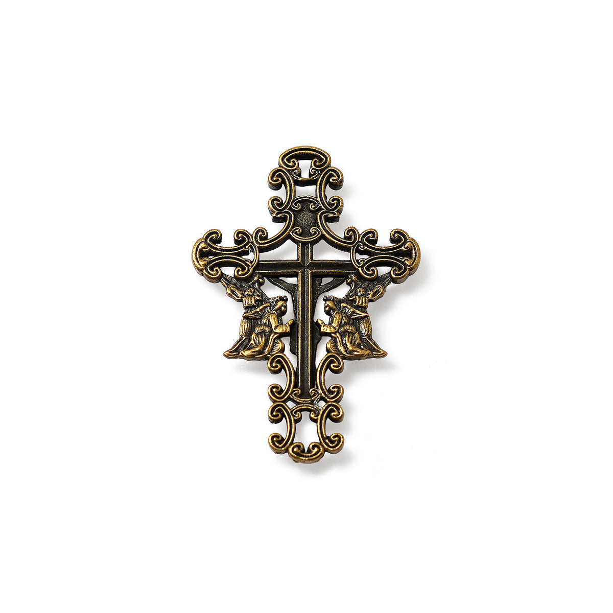 Decorative cross pendant on a white background