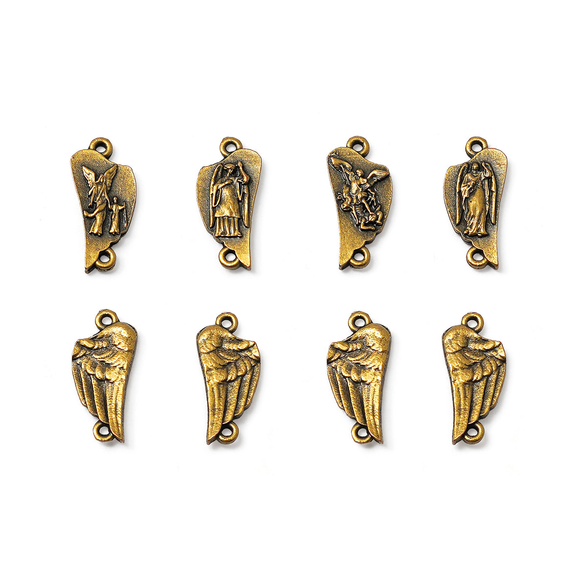 Set of gold angel and wing charms on a white background