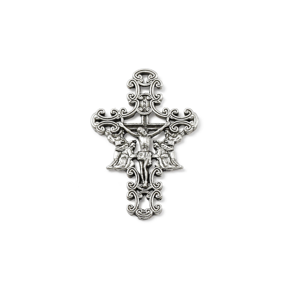 Decorative silver cross pendant on a white background