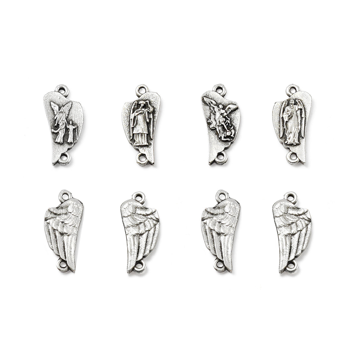 Set of silver angel pendants on a white background