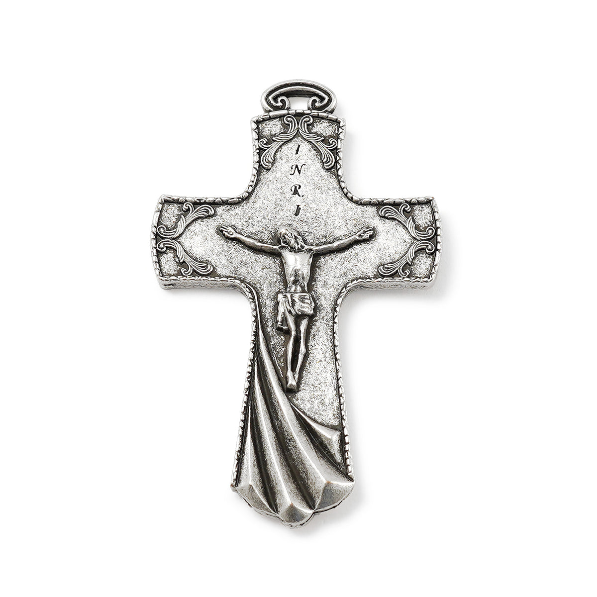 Silver cross pendant with Jesus Christ figure on a white background
