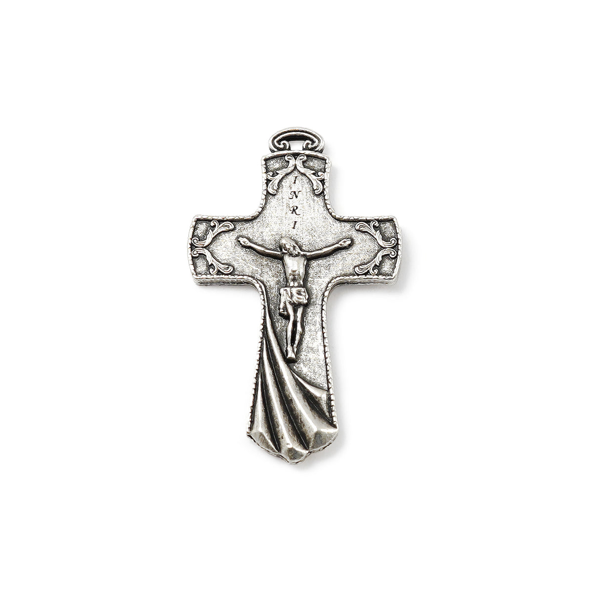Silver cross pendant with intricate design on a white background