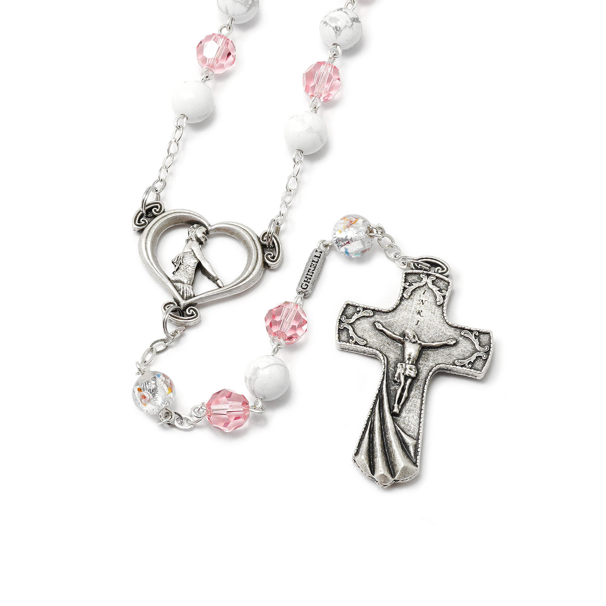 Rosary with pink and white beads on a white background
