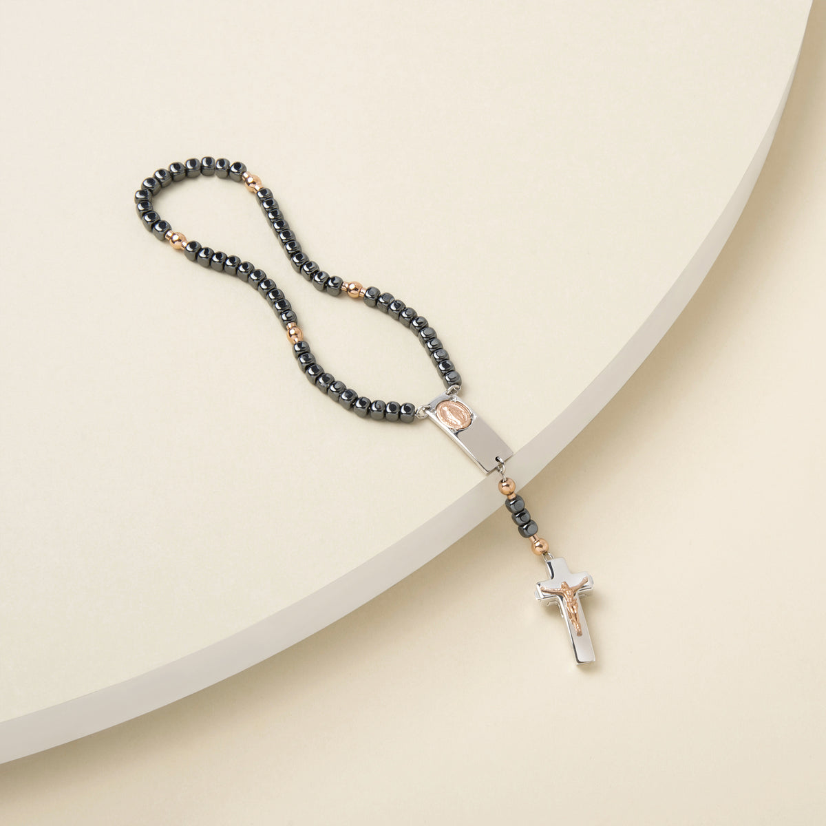 Rosalet polished hematite rosary bracelet with rose gold Pater beads