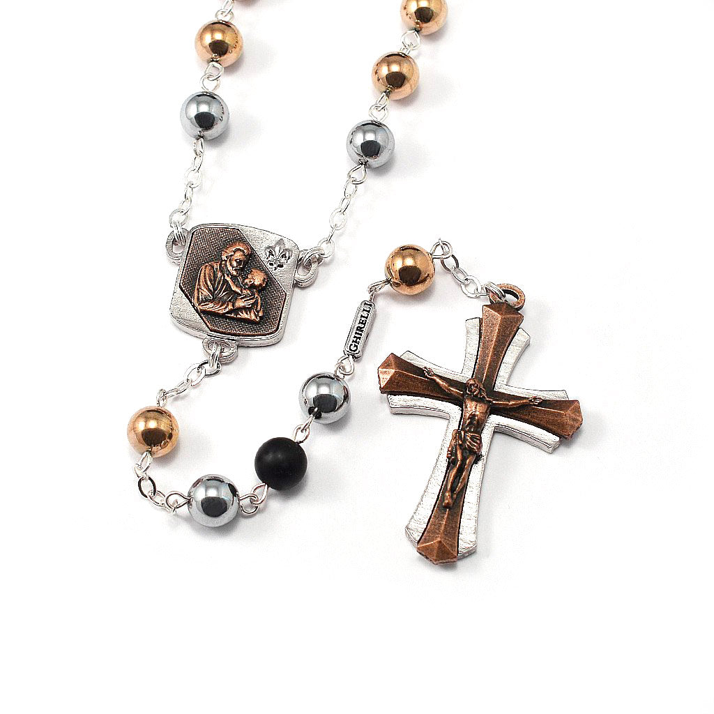Two-tone finish rosary with silver, copper, and black beads, featuring a centerpiece with an image of Saint Joseph and a cross.