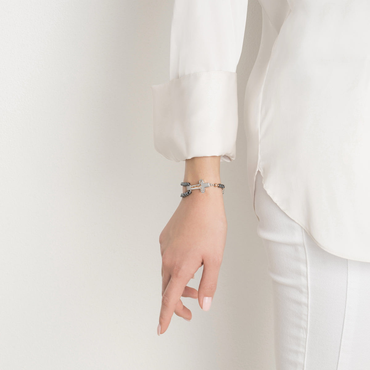 Sterling silver crucifix clasp with rose gold accents