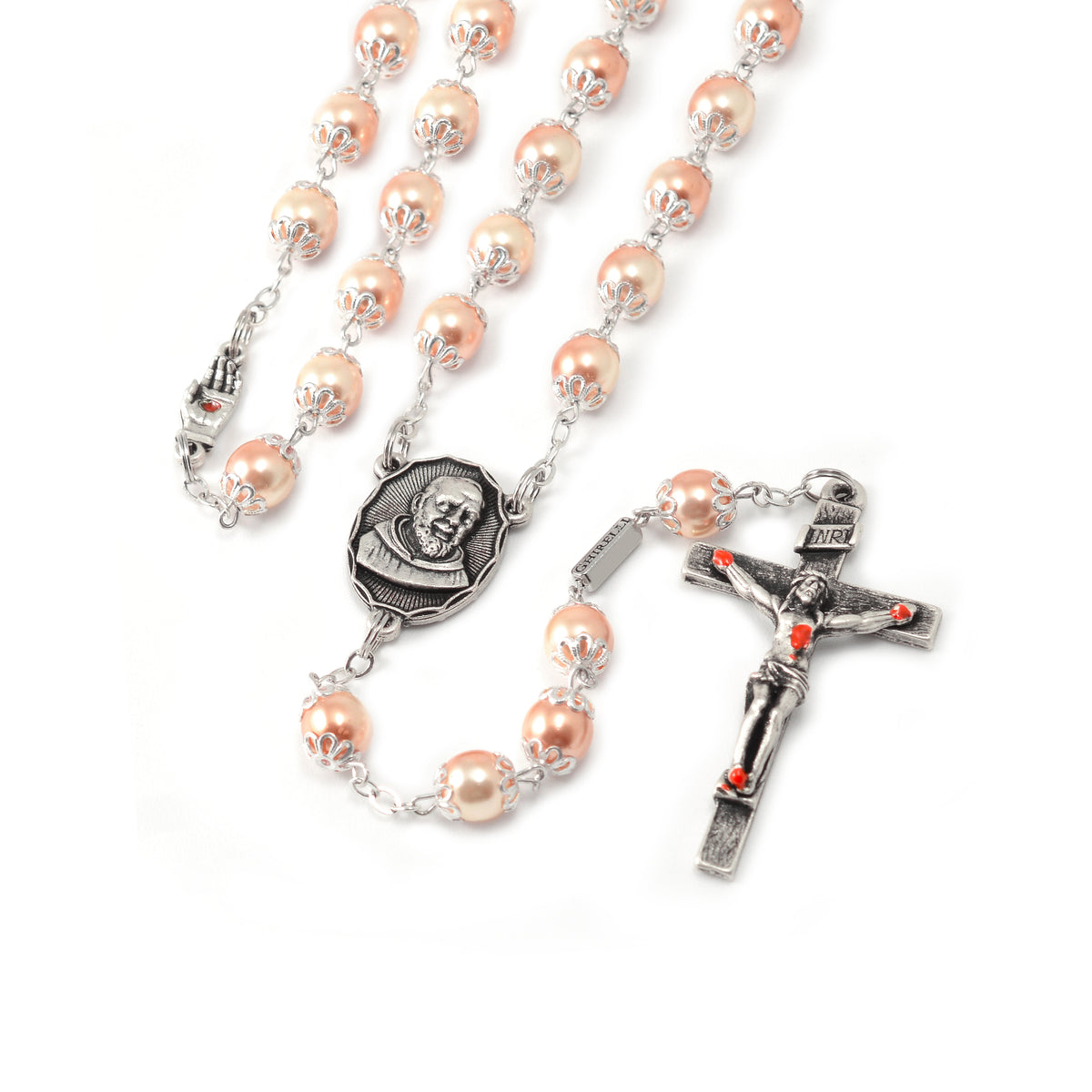 A rosary with pink pearl beads and antique silver caps, featuring an image of Saint Pio on the centerpiece and a special crucifix with red hand-enameled wounds.